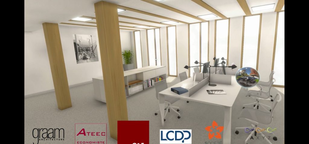 Bureaux en openspace avec ordinateurs et bibliothèques pour le projet Graam